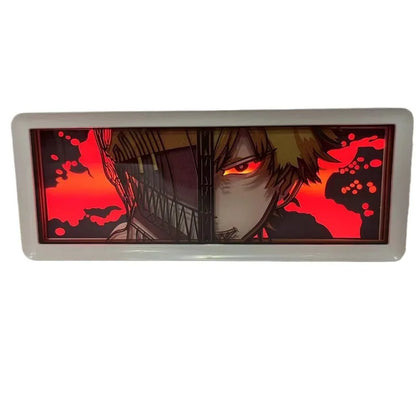 Lampe Décorative Chainsaw Man | Boîte lumineuse avec design en papier découpé représentant le visage de Denji et Pochita. Parfaite pour décorer une chambre ou un bureau, cette lampe offre une ambiance unique pour les fans de manga et d'anime