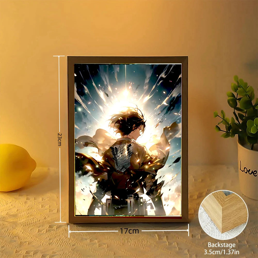 Cadre Lumineux LED Attack on Titan | Illuminez votre espace avec ce cadre photo mettant en scène les personnages emblématiques Levi et Mikasa. Ce cadre lumineux est parfait pour une ambiance unique et constitue un excellent cadeau