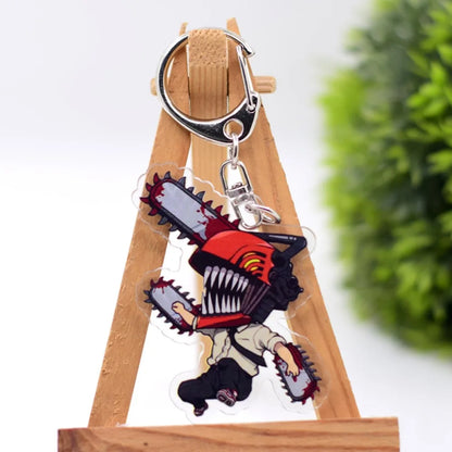 Porte-clés en acrylique double face avec des illustrations de personnages de Chainsaw Man. Accessoire parfait pour les fans, idéal comme pendentif pour sac ou trousseau de clés. Design tendance et pratique, parfait pour un cadeau ou une collection