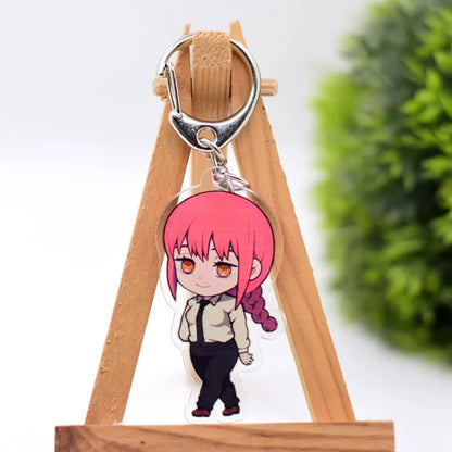 Porte-clés en acrylique double face avec des illustrations de personnages de Chainsaw Man. Accessoire parfait pour les fans, idéal comme pendentif pour sac ou trousseau de clés. Design tendance et pratique, parfait pour un cadeau ou une collection