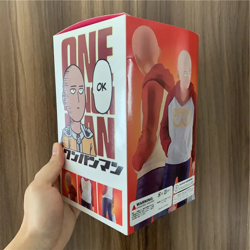 Figura One Punch Man de 18 cm | Figura de PVC de Saitama con una sudadera con capucha oppai, que captura un momento casual del héroe. Ideal para coleccionistas y fans de One Punch Man, así como como decoración o regalo.