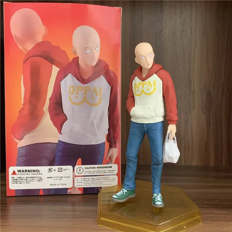 Figura One Punch Man de 18 cm | Figura de PVC de Saitama con una sudadera con capucha oppai, que captura un momento casual del héroe. Ideal para coleccionistas y fans de One Punch Man, así como como decoración o regalo.