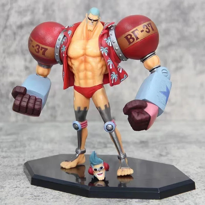 18cm Figurine One Piece | Figurine de collection représentant Franky en mode combat. Ce modèle détaillé avec deux têtes interchangeables est idéal pour décorer et parfait pour un cadeau de Noël pour les fans de One Piece !