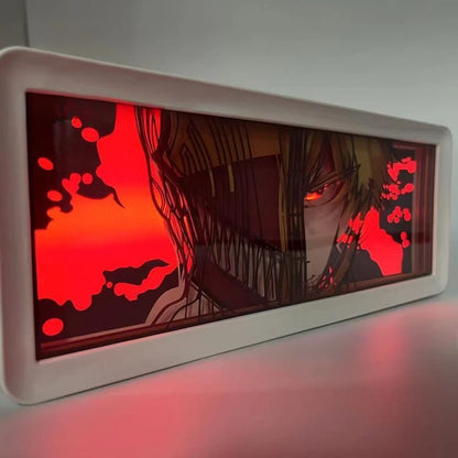 Lampe Décorative Chainsaw Man | Boîte lumineuse avec design en papier découpé représentant le visage de Denji et Pochita. Parfaite pour décorer une chambre ou un bureau, cette lampe offre une ambiance unique pour les fans de manga et d'anime