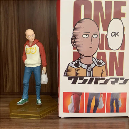 Figura One Punch Man de 18 cm | Figura de PVC de Saitama con una sudadera con capucha oppai, que captura un momento casual del héroe. Ideal para coleccionistas y fans de One Punch Man, así como como decoración o regalo.