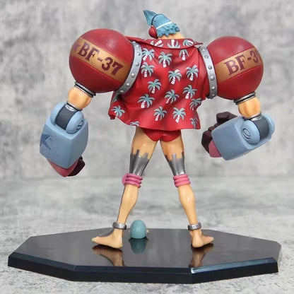 18cm Figurine One Piece | Figurine de collection représentant Franky en mode combat. Ce modèle détaillé avec deux têtes interchangeables est idéal pour décorer et parfait pour un cadeau de Noël pour les fans de One Piece !